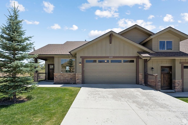 14482 N Buck Horn Trl Unit 50A, Heber City, UT 84032 - craftsman house with board and batten siding, stone siding, an attached garage, concrete driveway, and a front yard
