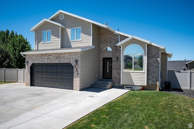 2371 N 1110 W, Clinton, UT 84015 - view of front of home with a garage, driveway, and brick siding