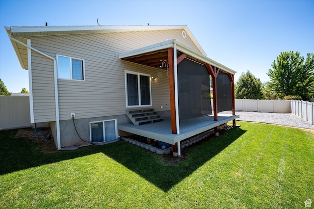 2371 N 1110 W, Clinton, UT 84015 - back of house with a fenced backyard, a sunroom, and a wooden deck