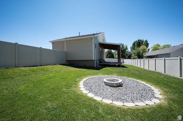 2371 N 1110 W, Clinton, UT 84015 - fenced backyard with an outdoor fire pit