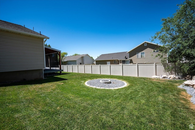 2371 N 1110 W, Clinton, UT 84015 - view of yard featuring a sunroom and a fire pit