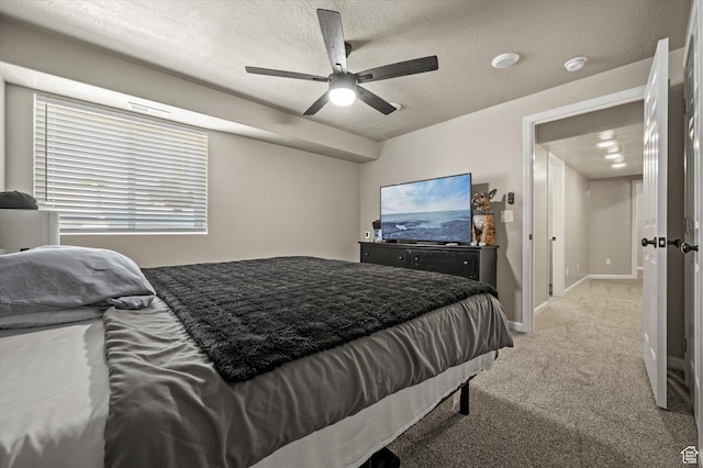 2371 N 1110 W, Clinton, UT 84015 - bedroom featuring light colored carpet, a textured ceiling, and a ceiling fan