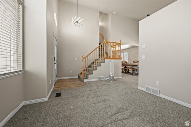 2371 N 1110 W, Clinton, UT 84015 - carpeted entryway featuring stairway and a towering ceiling