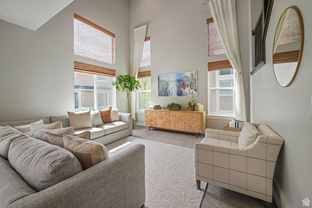 933 S 2100 W, Orem, UT 84059 - carpeted living room featuring a towering ceiling and baseboards