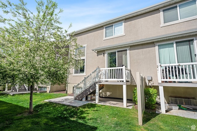 933 S 2100 W, Orem, UT 84059 - rear view of property featuring stucco siding, a yard, and stairs