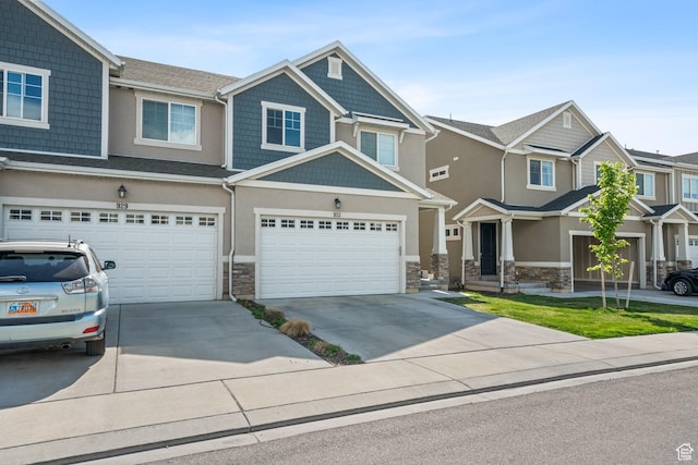 933 S 2100 W, Orem, UT 84059 - craftsman inspired home with stone siding, concrete driveway, and an attached garage