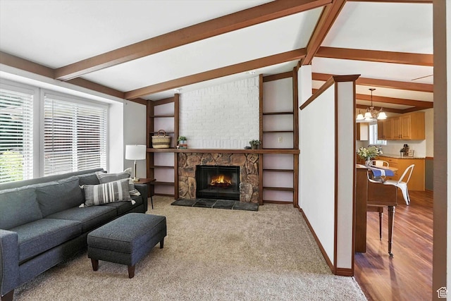 80 S 6000 W, Mendon, UT 84325 - carpeted living room featuring a chandelier and a stone fireplace