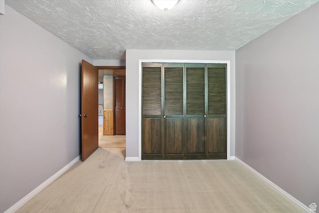 80 S 6000 W, Mendon, UT 84325 - unfurnished bedroom with carpet flooring, a closet, and a textured ceiling
