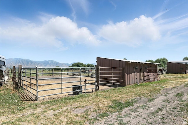 80 S 6000 W, Mendon, UT 84325 - view of yard featuring an exterior structure, a mountain view, an outbuilding, and a rural view