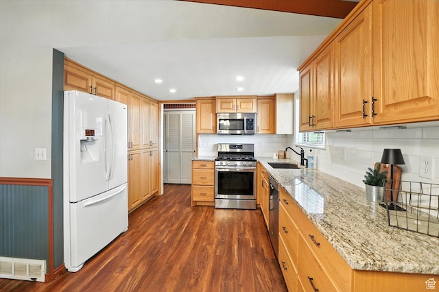 80 S 6000 W, Mendon, UT 84325 - kitchen with appliances with stainless steel finishes, dark wood-style flooring, light stone countertops, backsplash, and recessed lighting