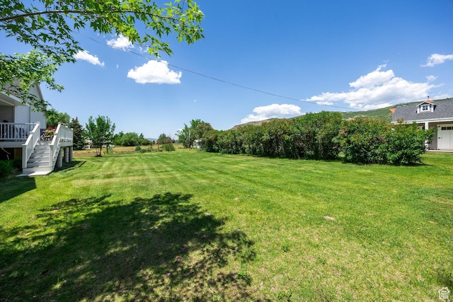 2565 E Woodland Way, Kamas, UT 84036 - view of green lawn with a deck and stairs
