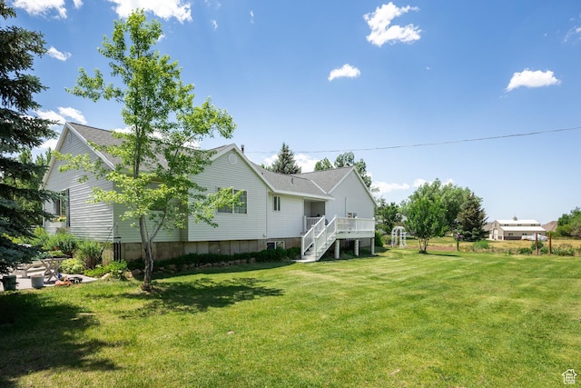 2565 E Woodland Way, Kamas, UT 84036 - back of property with stairs, a lawn, a deck, and roof with shingles