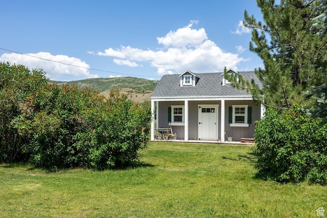 2565 E Woodland Way, Kamas, UT 84036 - view of front of property with a front lawn, covered porch, and roof with shingles