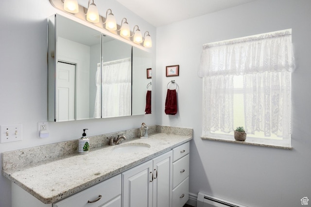 2565 E Woodland Way, Kamas, UT 84036 - full bathroom with vanity, a baseboard radiator, and plenty of natural light