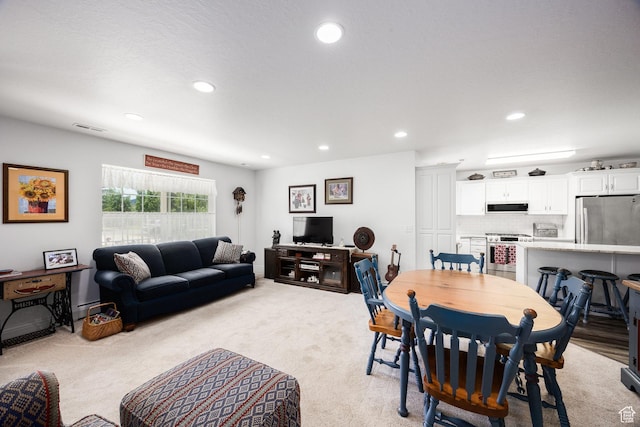 2565 E Woodland Way, Kamas, UT 84036 - dining space featuring recessed lighting, a baseboard radiator, and light carpet