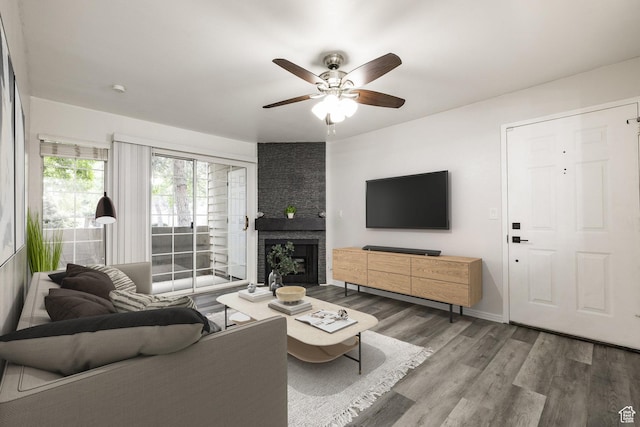 650 S Main St Unit 3102, Bountiful, UT 84010 - living area featuring wood finished floors, ceiling fan, and a fireplace