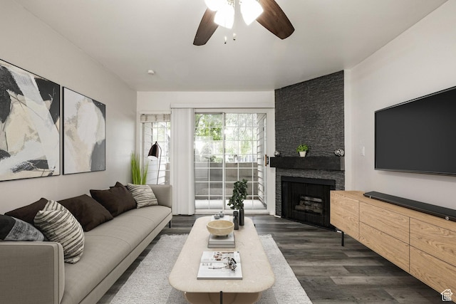 650 S Main St Unit 3102, Bountiful, UT 84010 - living room with a ceiling fan, dark wood-style floors, and a stone fireplace