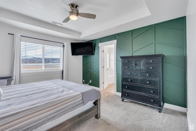 1769 W Stone Gate Dr, Saratoga Springs, UT 84045 - bedroom featuring light carpet, a raised ceiling, a ceiling fan, a decorative wall, and ensuite bathroom