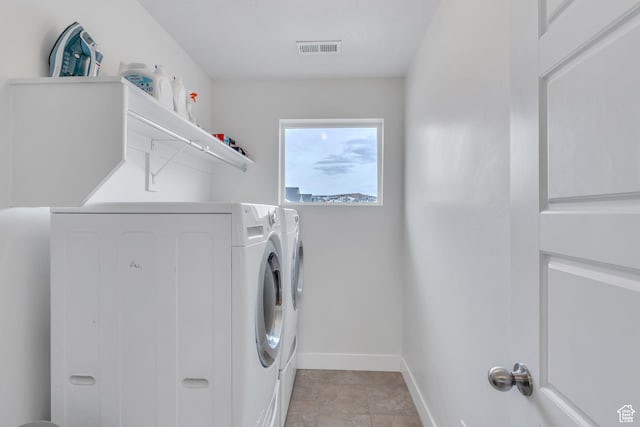 1769 W Stone Gate Dr, Saratoga Springs, UT 84045 - washroom featuring washing machine and clothes dryer and baseboards