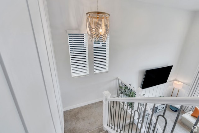 1769 W Stone Gate Dr, Saratoga Springs, UT 84045 - stairs with a chandelier and carpet floors