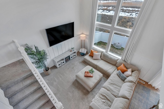 1769 W Stone Gate Dr, Saratoga Springs, UT 84045 - carpeted living room with a decorative wall and wainscoting