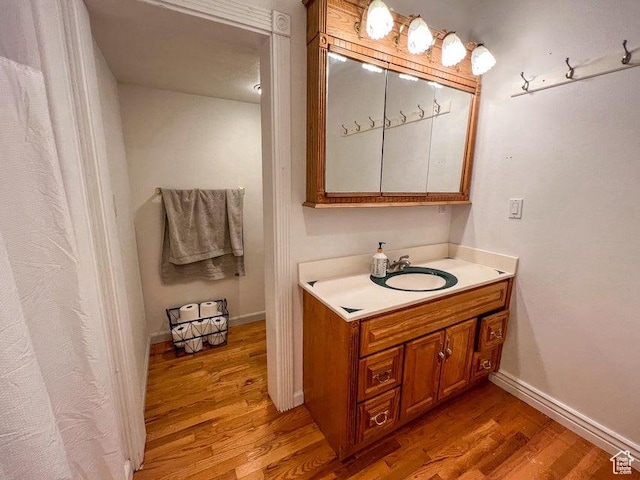 398 E Wells Fargo Rd, Brookside, UT 84782 - bathroom with wood finished floors and vanity