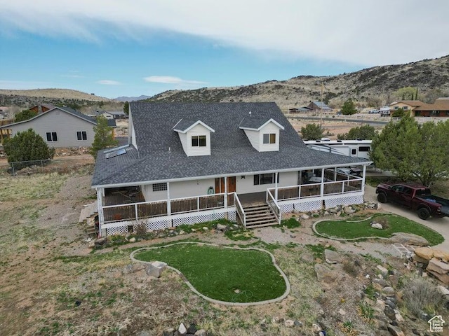 398 E Wells Fargo Rd, Brookside, UT 84782 - view of front of home with a mountain view, roof with shingles, and a porch