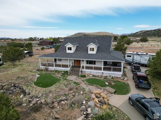 398 E Wells Fargo Rd, Brookside, UT 84782 - country-style home featuring a porch, roof with shingles, and a mountain view