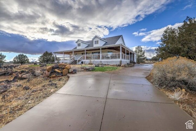 398 E Wells Fargo Rd, Brookside, UT 84782 - farmhouse-style home featuring covered porch and driveway