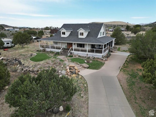 398 E Wells Fargo Rd, Brookside, UT 84782 - farmhouse featuring driveway, a porch, and roof with shingles