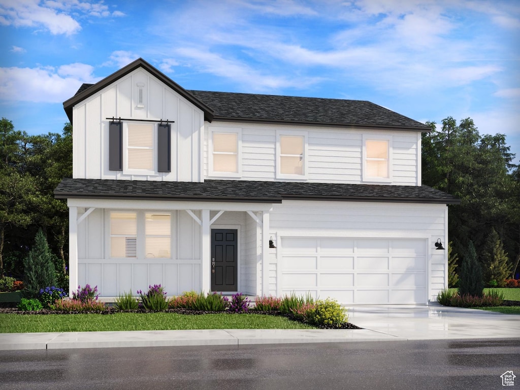1368 N Baen Way Unit 0236, Tooele, UT 84074 - view of front of house featuring board and batten siding, driveway, and an attached garage
