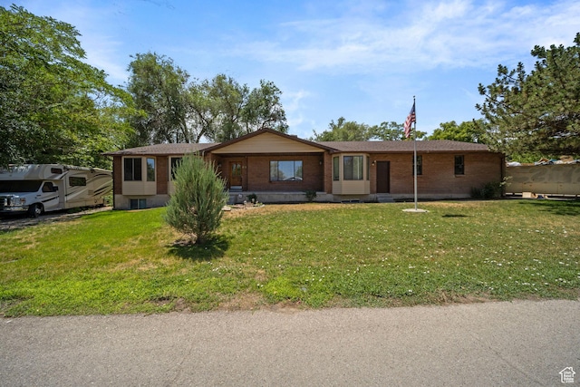 5350 S Jordan Canal Rd, Salt Lake City, UT 84129 - single story home with brick siding and a front lawn