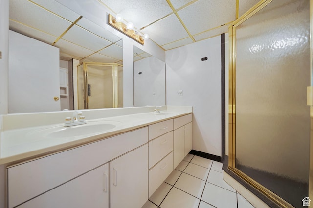 5350 S Jordan Canal Rd, Salt Lake City, UT 84129 - full bath featuring a drop ceiling, double vanity, a stall shower, and tile patterned flooring