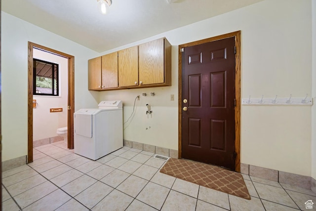 5350 S Jordan Canal Rd, Salt Lake City, UT 84129 - washroom with washer / clothes dryer, cabinet space, and light tile patterned floors
