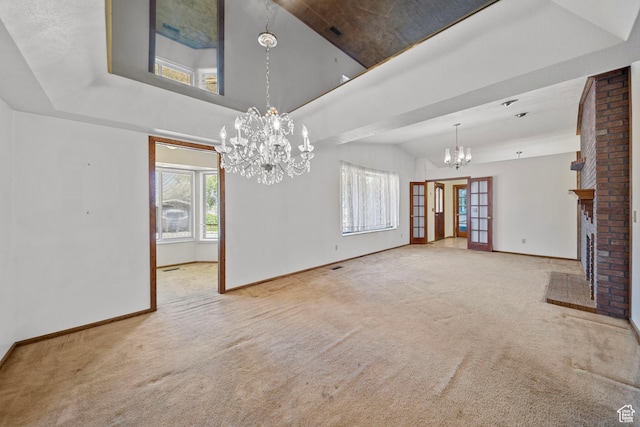 5350 S Jordan Canal Rd, Salt Lake City, UT 84129 - unfurnished living room featuring a chandelier, carpet flooring, a brick fireplace, high vaulted ceiling, and french doors