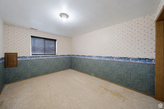 5350 S Jordan Canal Rd, Salt Lake City, UT 84129 - carpeted empty room featuring wallpapered walls and wainscoting