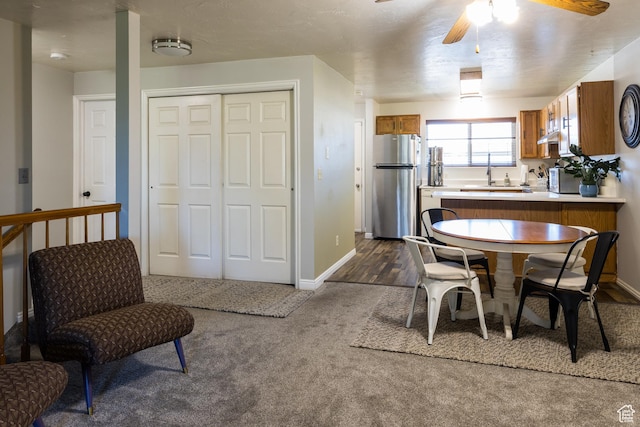 63 S 100 W Unit 17, American Fork, UT 84003 - dining area with a ceiling fan and dark carpet