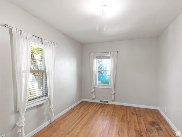 1740 E Harrison Ave, Salt Lake City, UT 84108 - spare room featuring light wood-style floors and baseboards
