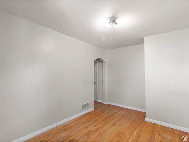 1740 E Harrison Ave, Salt Lake City, UT 84108 - unfurnished room with arched walkways and light wood-style floors