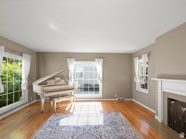 1740 E Harrison Ave, Salt Lake City, UT 84108 - living area featuring wood finished floors and a fireplace with flush hearth