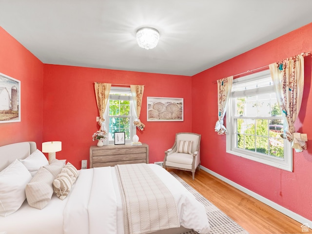 1740 E Harrison Ave, Salt Lake City, UT 84108 - bedroom featuring light wood-style floors and baseboards