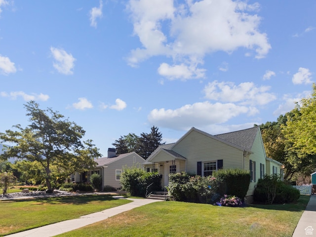 1740 E Harrison Ave, Salt Lake City, UT 84108 - view of front of house featuring a front yard and a shingled roof