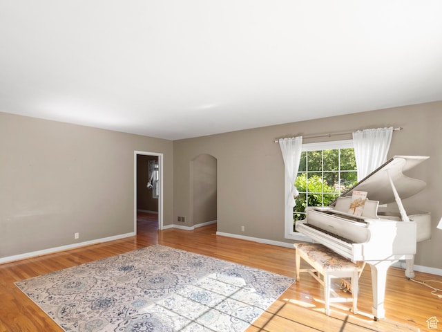 1740 E Harrison Ave, Salt Lake City, UT 84108 - living area featuring arched walkways and wood finished floors