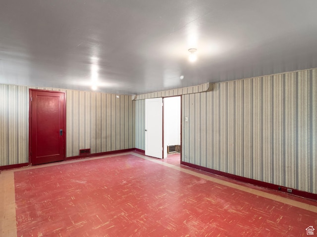 1740 E Harrison Ave, Salt Lake City, UT 84108 - empty room with tile patterned floors and wallpapered walls