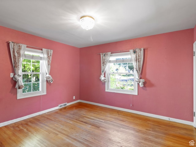 1740 E Harrison Ave, Salt Lake City, UT 84108 - unfurnished room featuring wood finished floors and baseboards