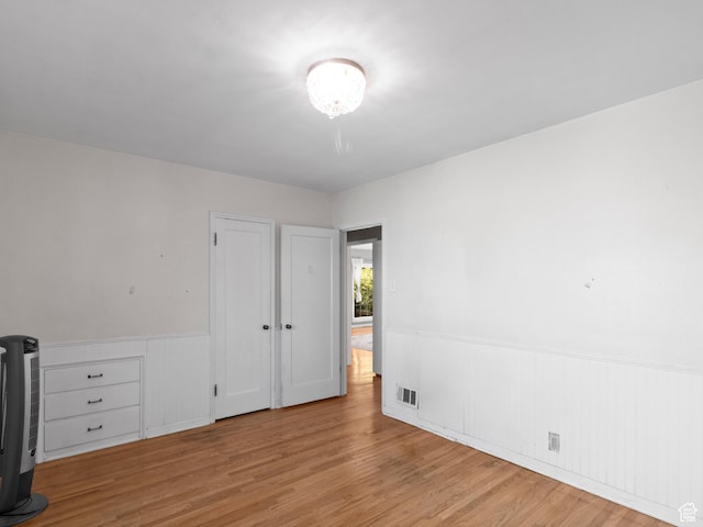1740 E Harrison Ave, Salt Lake City, UT 84108 - unfurnished bedroom with wainscoting and wood finished floors