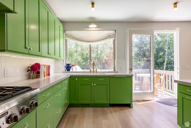 1675 W Silver Springs Rd, Park City, UT 84098 - kitchen with green cabinetry, healthy amount of natural light, stainless steel gas cooktop, and light wood-style flooring