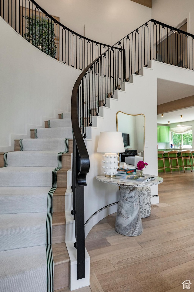 1675 W Silver Springs Rd, Park City, UT 84098 - stairway featuring a towering ceiling and wood finished floors