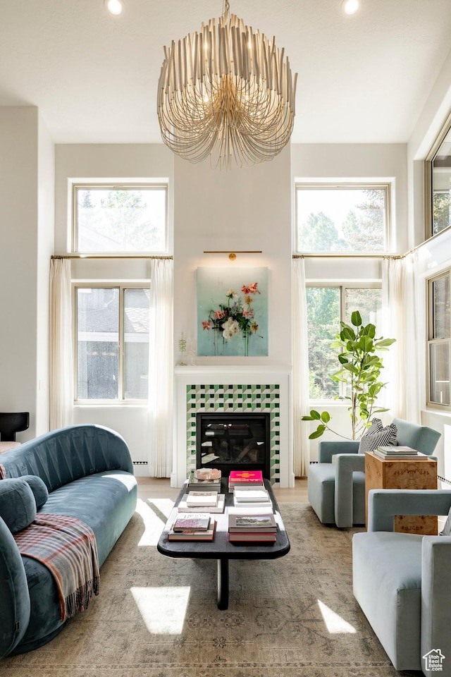 1675 W Silver Springs Rd, Park City, UT 84098 - living room featuring recessed lighting, a fireplace, wood finished floors, and a chandelier