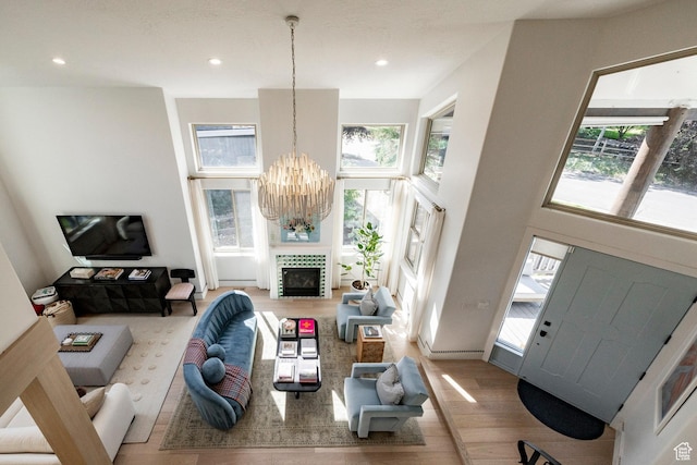 1675 W Silver Springs Rd, Park City, UT 84098 - living room with a chandelier, wood finished floors, recessed lighting, and a towering ceiling